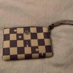 Corner zip wristlet with checkerboard print in violet /chalk. Beautiful pattern!